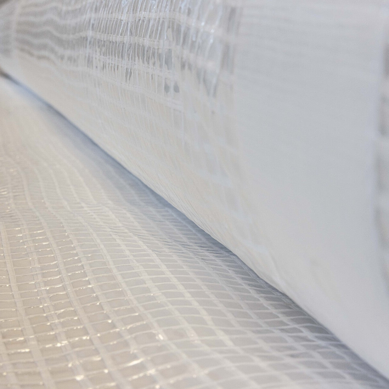 Heavy-duty 170gsm scaffold sheeting for wind, dust, and debris protection on worksites.