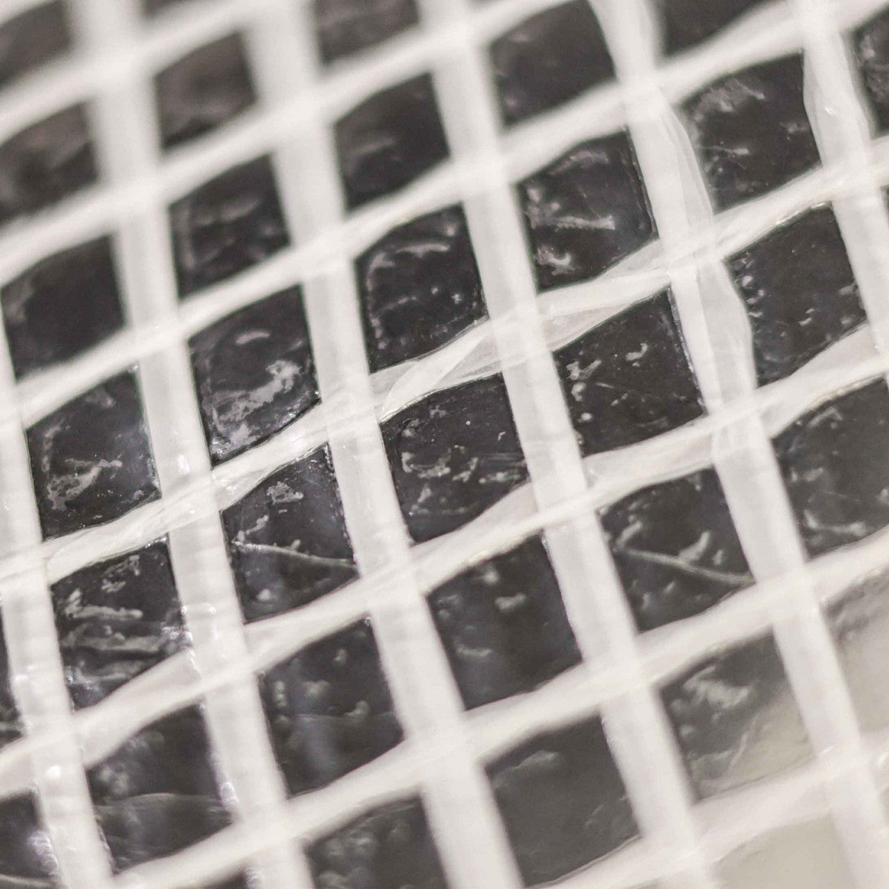 Close-up of 170gsm transparent mono cover tarpaulin for covering equipment or surfaces.