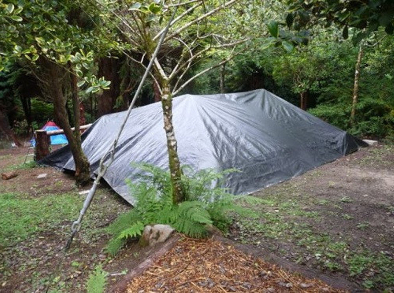 270gsm waterproof tarpaulin in black/silver for sheltering and industrial protection.