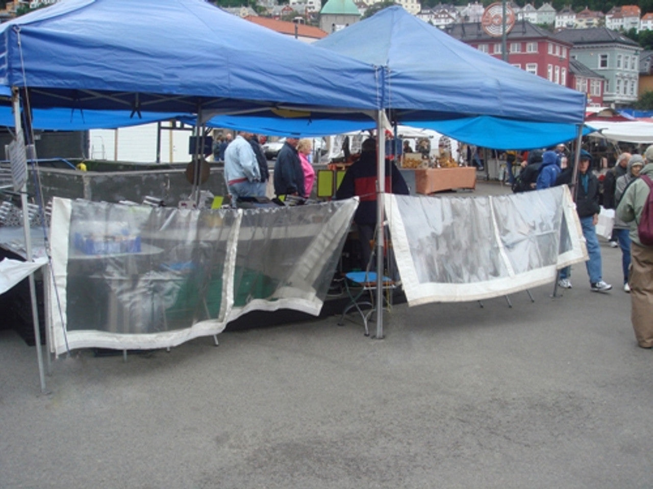 Heavy-duty 310gsm glass clear PVC tarpaulin for covering goods or equipment.