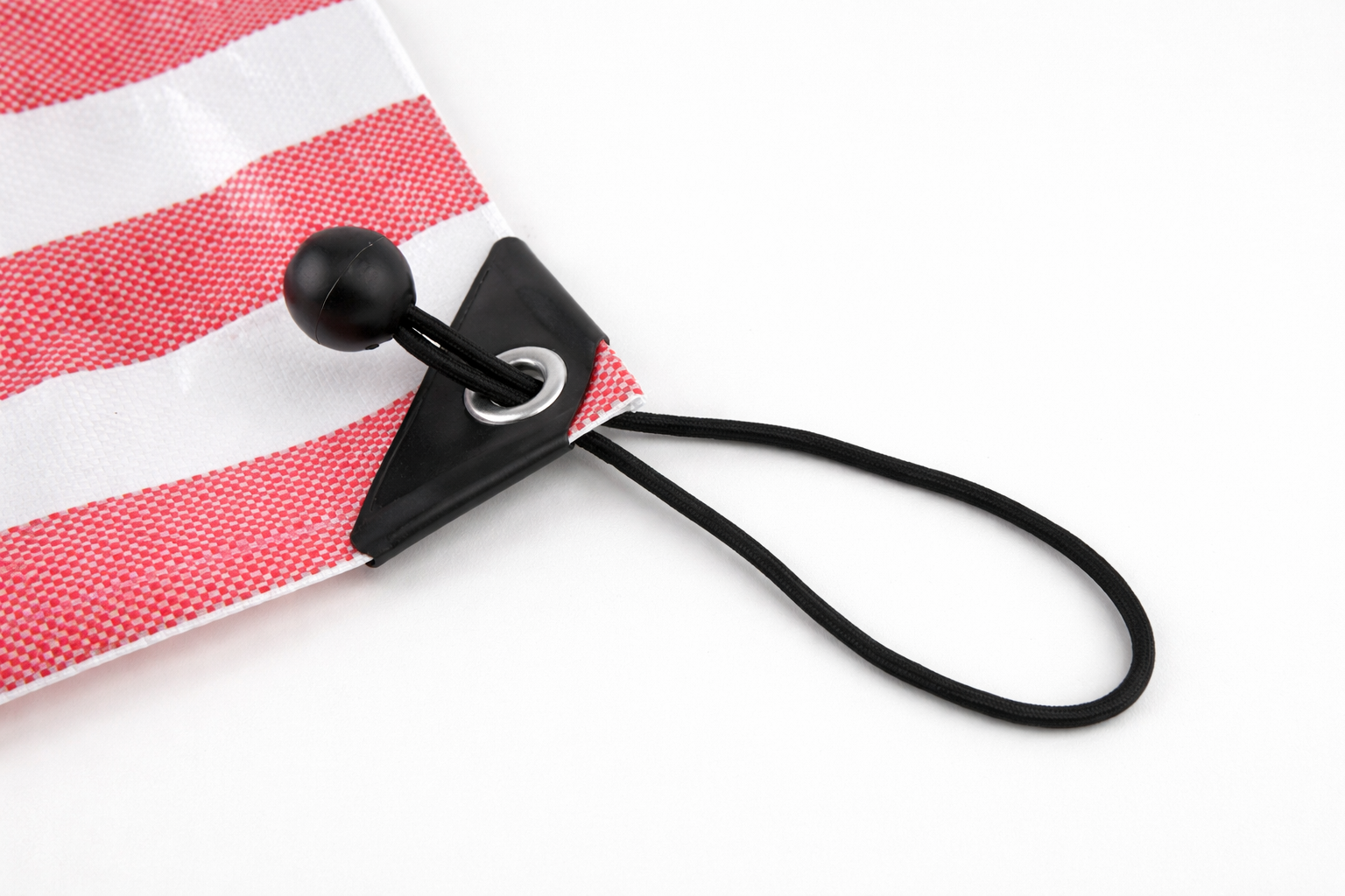 Using ball bungees to fasten a tent cover during camping.