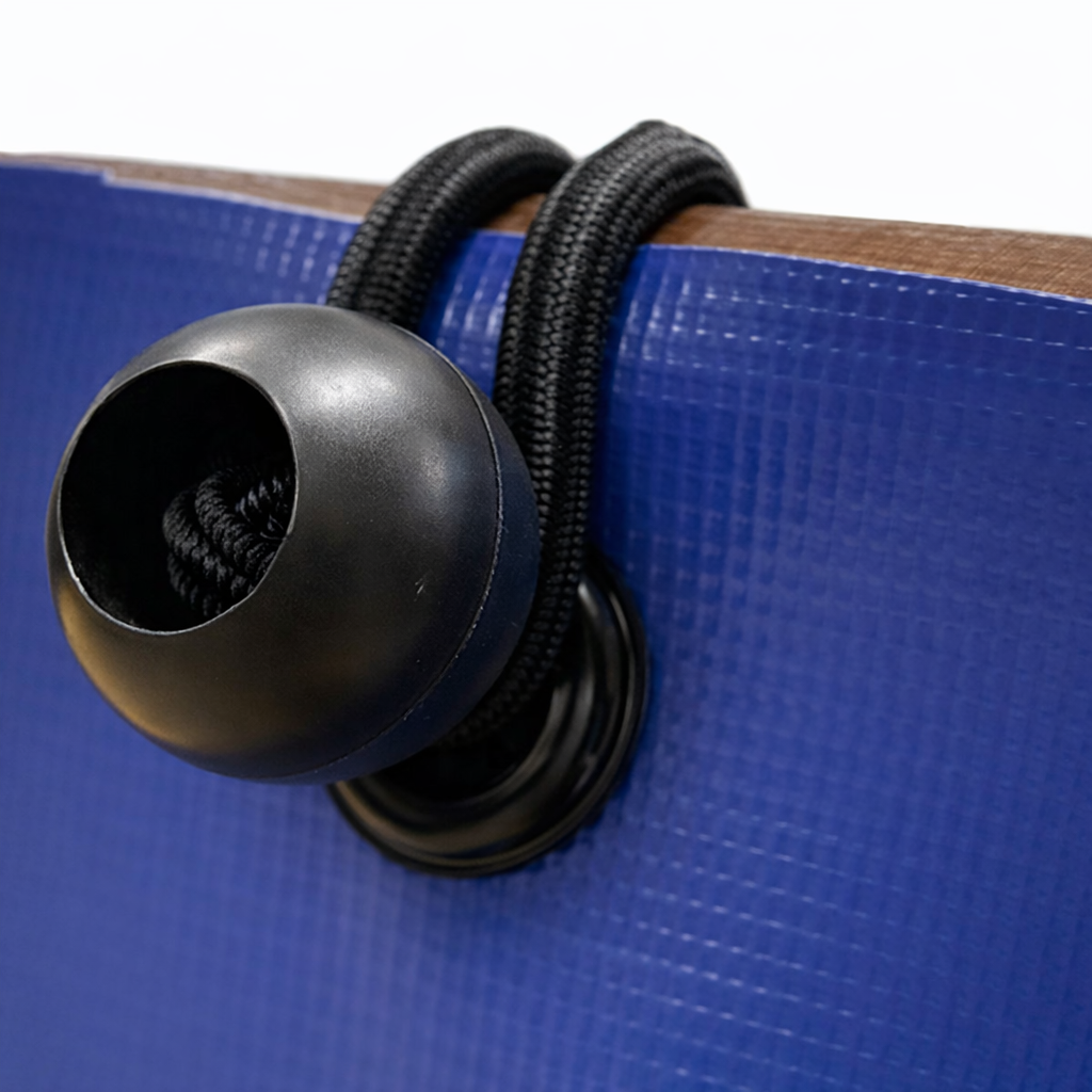 Close-up of ball bungees used to secure objects or covers.
