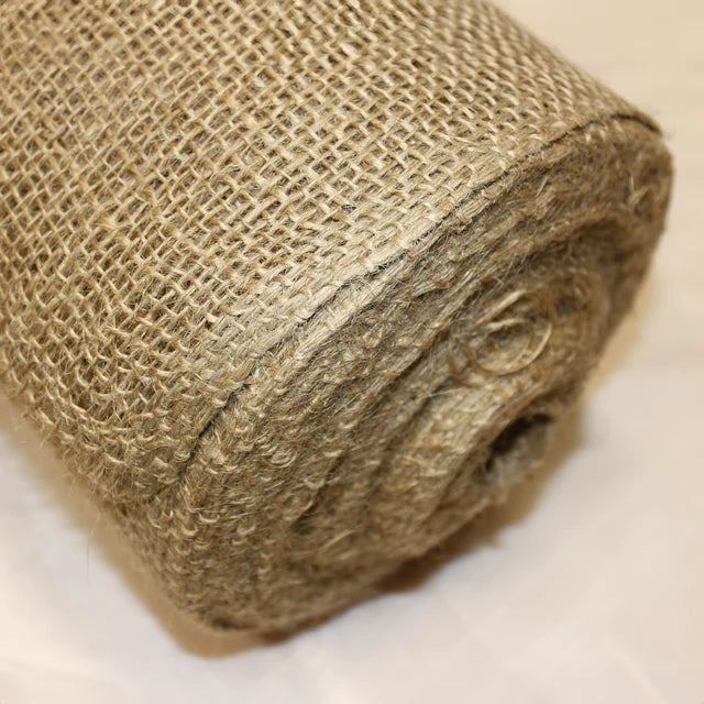 Rolls of hessian fabric showing coarse woven texture for crafting or industrial use.