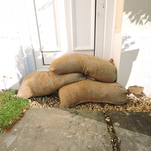 Durable sandbags filled and ready for securing areas against water or erosion.